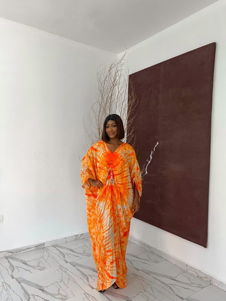 Bubu gown prices in lagos showing a picture of a woman wearing bubu gown made by tailored by adunni