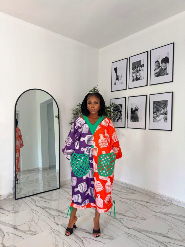 Bubu gown prices in lagos showing a picture of a woman wearing sofy midi bubu gown made by tailoredbyadunni