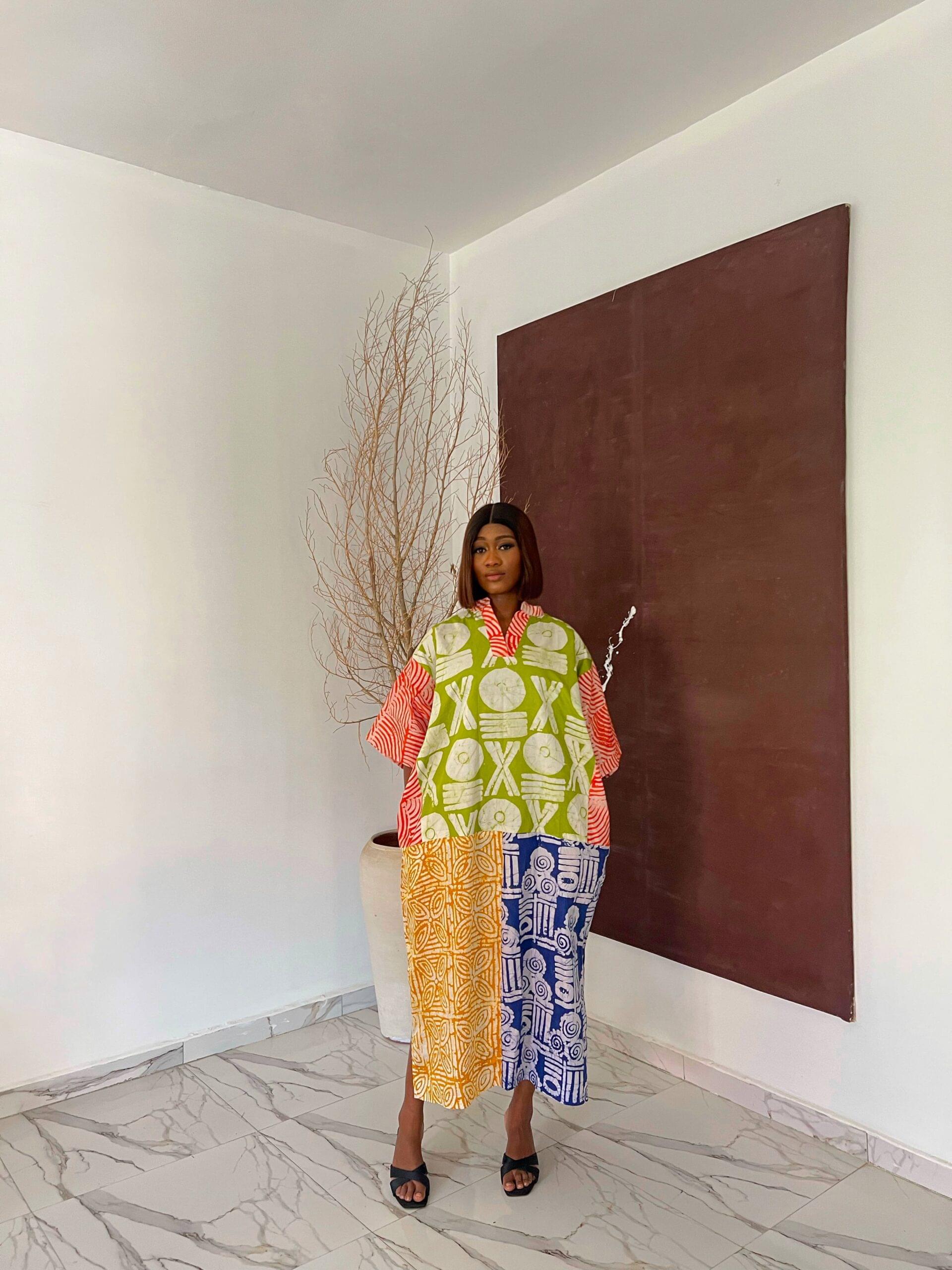 LAYO ADIRE MIX Colorful Adire Dress for Sale showing a picture of a woman wearing layo adire bubu made by tailored by adunni, a women's rtw clothing brand in ikeja lagos