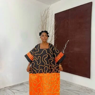 where to buy bubu gowns in lagos showing a picture of a woman wearing bubu gown made by tailoredbyadunni