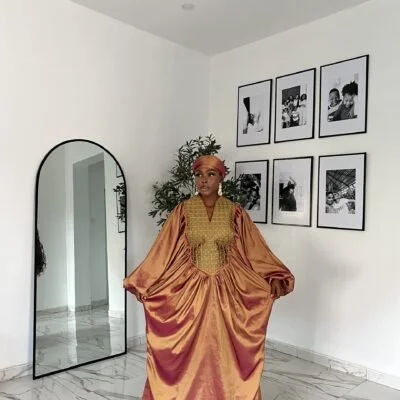 Bubu gown vendors in Lagos showing a picture of a woman wearing bubu gown made by Tailored by Adunni